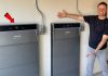 Nadwyżki energii elektrycznej – jak przekuć domowy i firmowy problem w realne oszczędności? Farma fotowoltaiczna z bateriami magazynującymi nadwyżki energii i liniami przesyłowymi